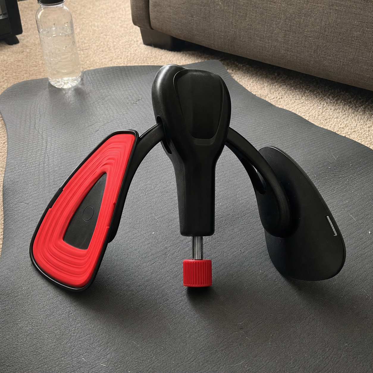 Body-Forge men's resistance trainer set up on an exercise mat